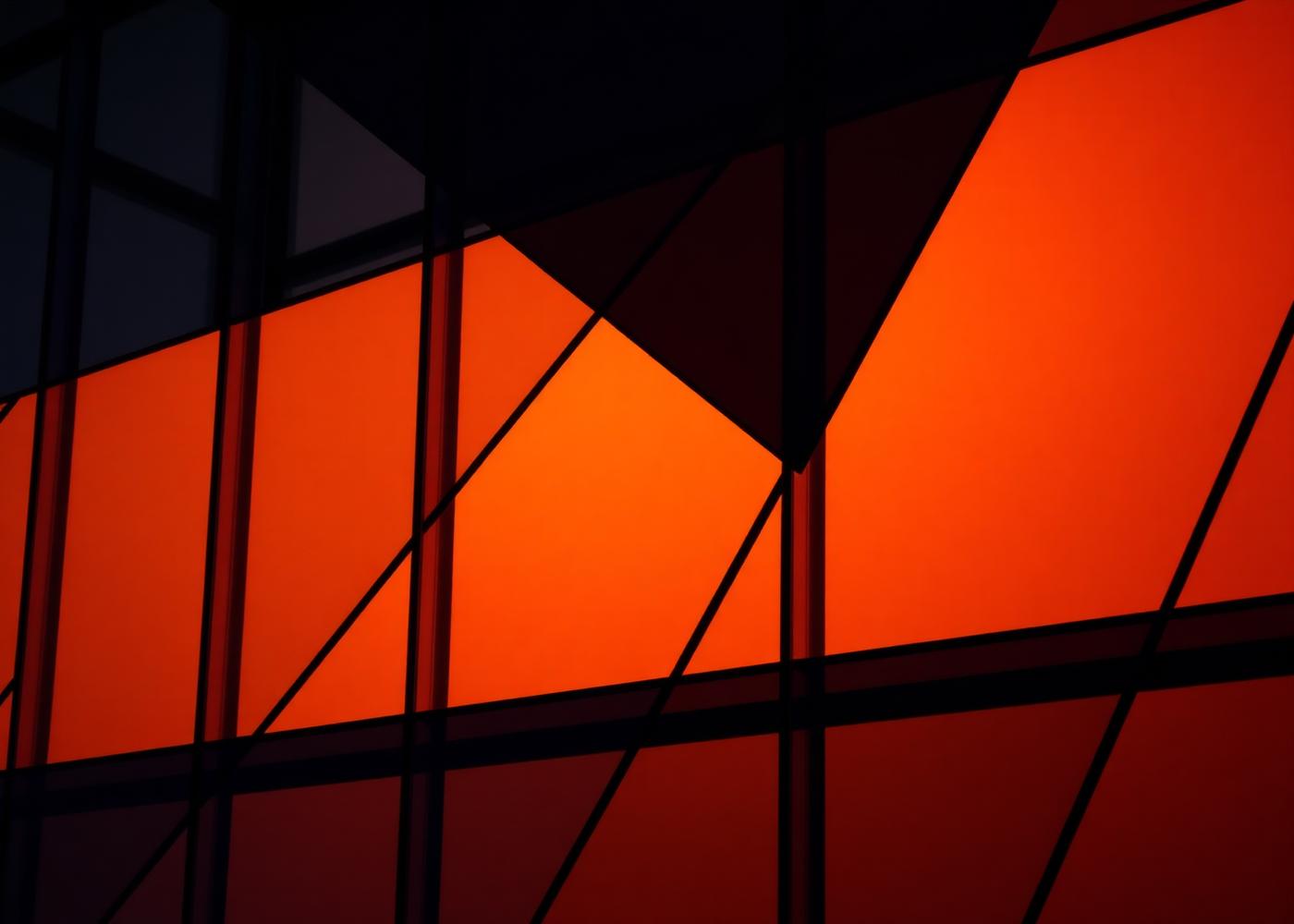 Angular composition of glass panels in warm and dark tones